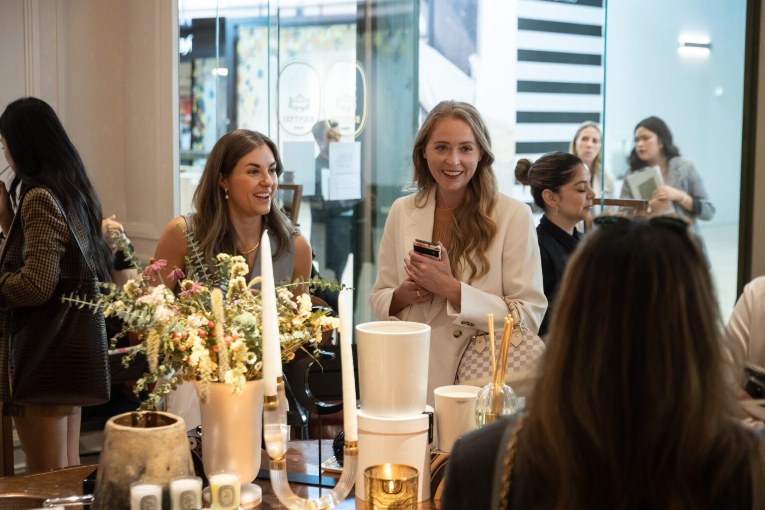Guests capture content at the Diptyque Yorkdale store opening in Toronto