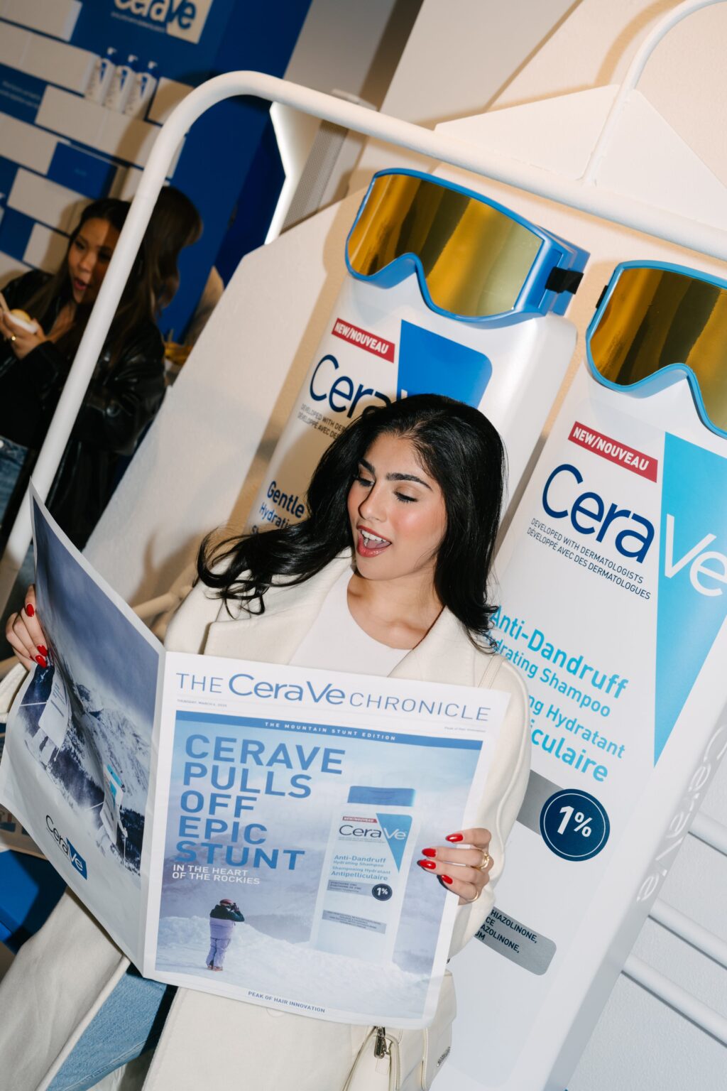 A Toronto creator reads the CeraVe Chronicle at the CeraVe Hair Care launch pop-up